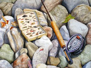 Fly fishing equipment on the rocks.
