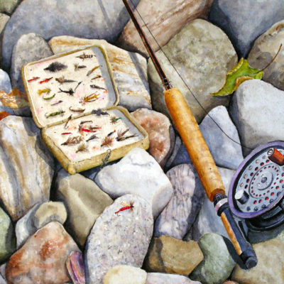Fly fishing equipment on the rocks.